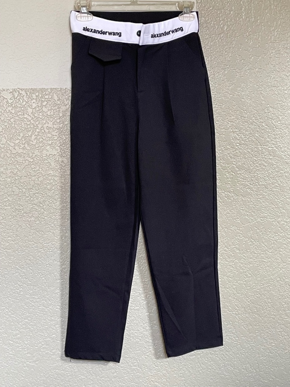 Black pants with white waistband and embroidery